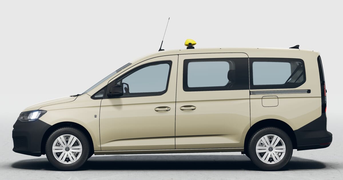 Volkswagen Taxi Caddy Maxi 7-Sitzer Außenfarbe Hellelfenbein R1015. Aufnahme Links seitlich.